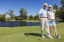 older couple golfing on golf course